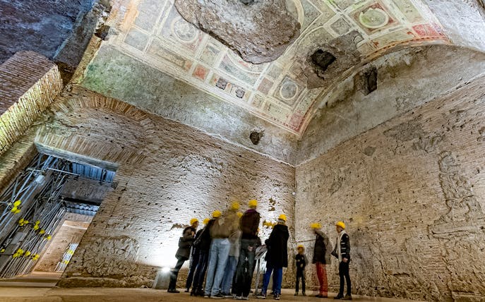 Guided group exploring Domus Aurea with virtual reality headsets in Rome.