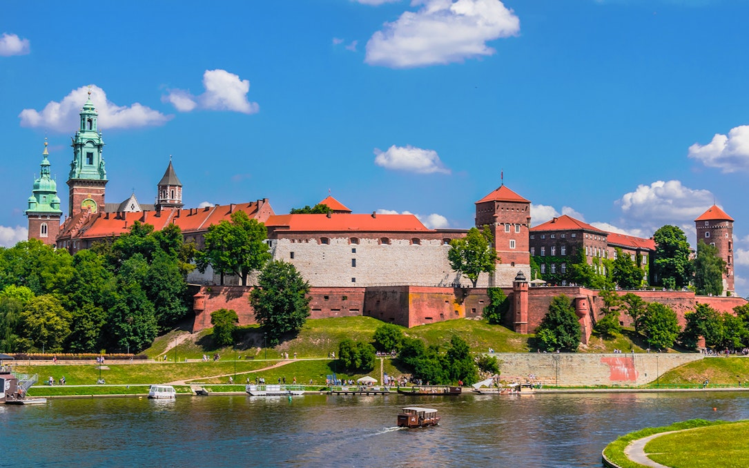 Wawel Castle viewed from the Vistula River during a sightseeing cruise in Krakow, Poland.