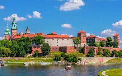 Wawel Castle viewed from the Vistula River during a sightseeing cruise in Krakow, Poland.