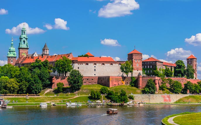 Wawel Castle viewed from the Vistula River during a sightseeing cruise in Krakow, Poland.