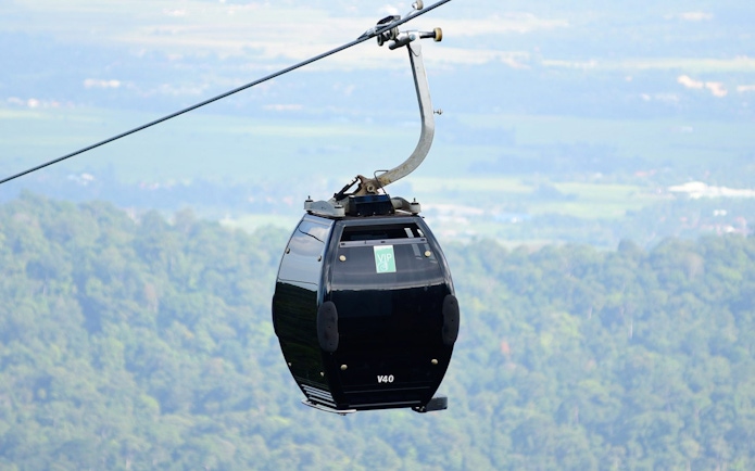 VIP gondola on Langkawi cable car with forest view.