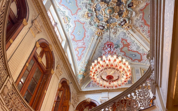Ornate ceiling and chandelier inside Dolmabahçe Palace, Istanbul.