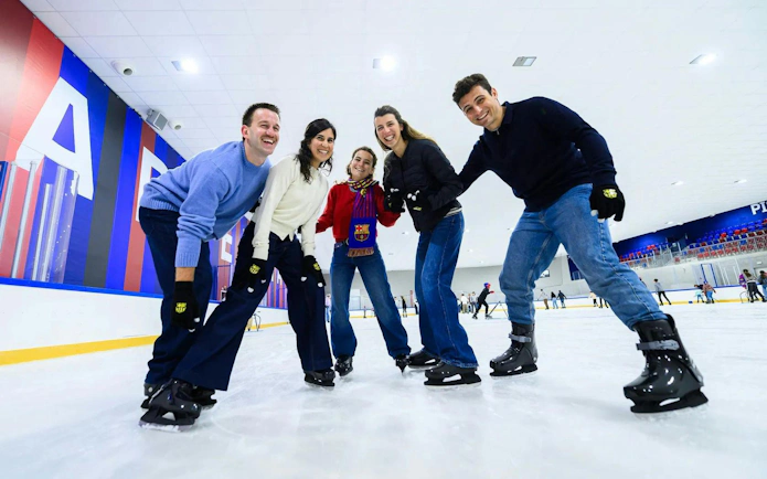 Group of people ice skating at FC Barcelona Ice Rink.