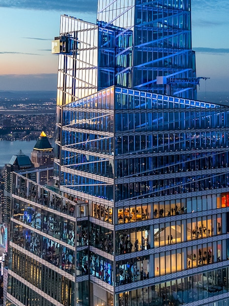 Aerial view of Summit One Vanderbilt with cityscape at sunset in New York City.
