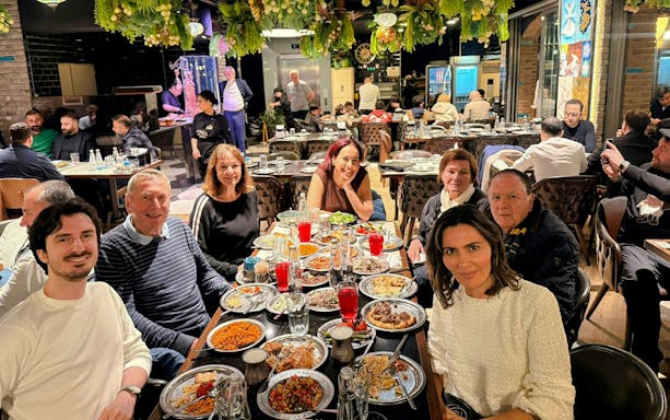Guests dining at a Turkish restaurant in Istanbul, enjoying traditional dishes.
