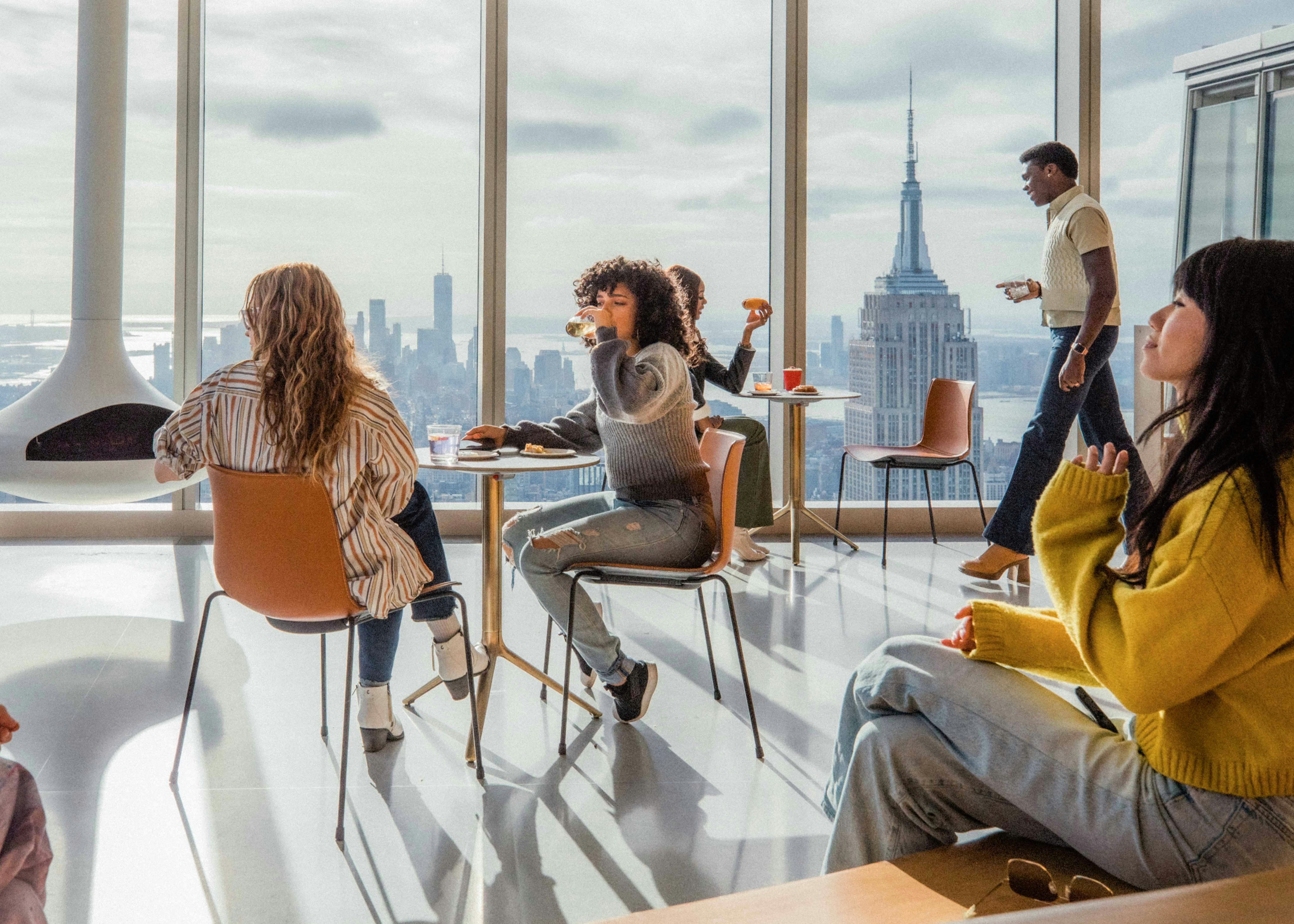 Visitors enjoying panoramic views from Summit One Vanderbilt observation deck in New York City.