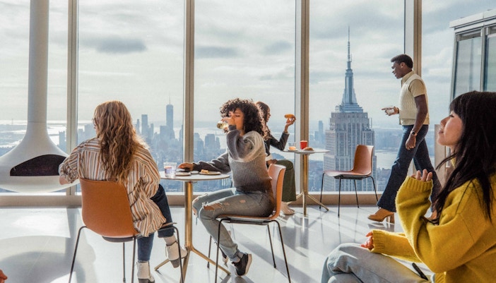 Visitors enjoying panoramic views from Summit One Vanderbilt observation deck in New York City.