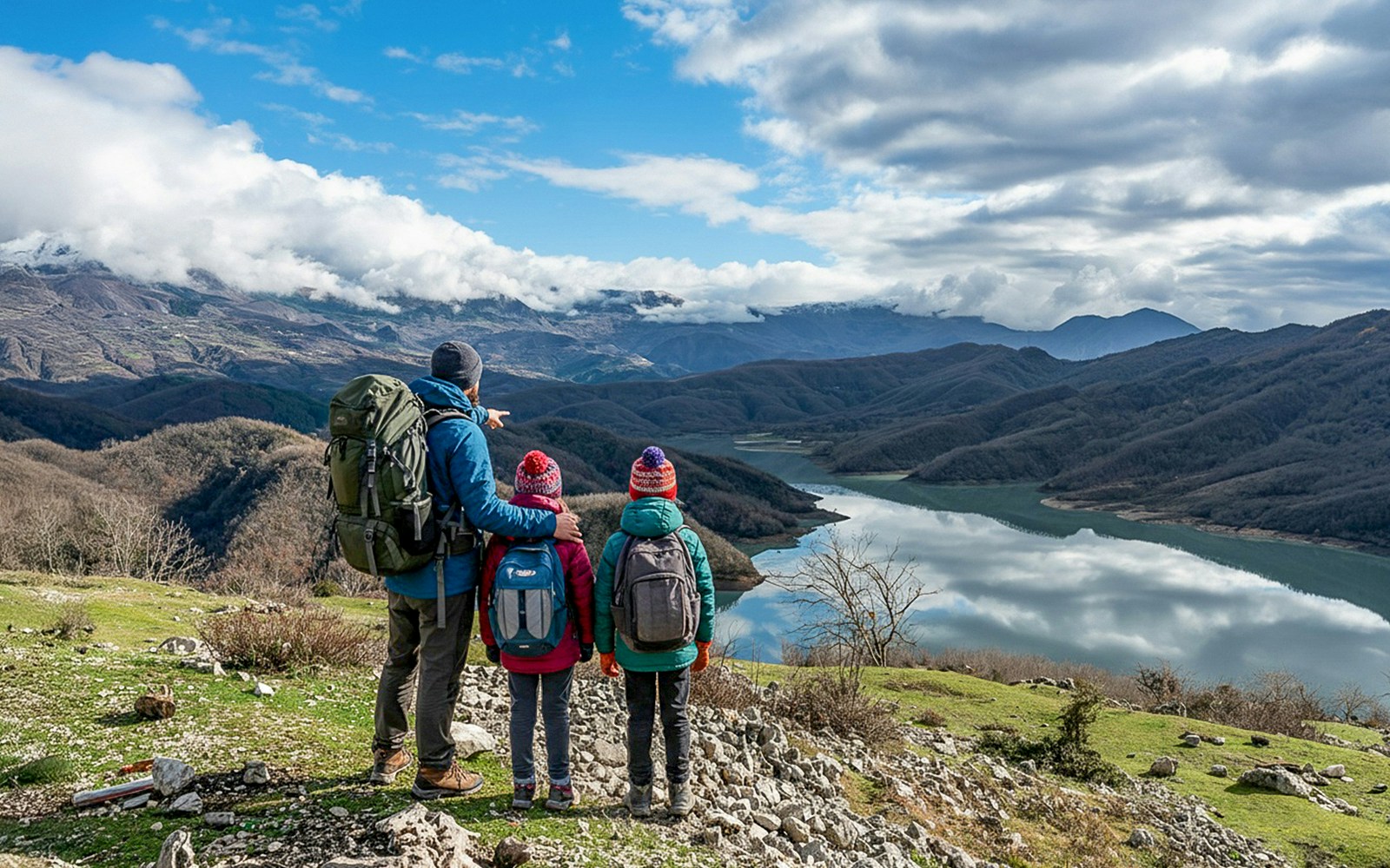 Family hiking near Bovilla Lake with mountain view in Albania.