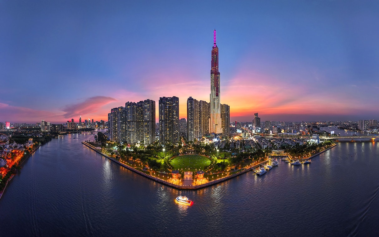 Ho Chi Minh City skyline at sunset with Landmark 81 and Saigon River, Vietnam.