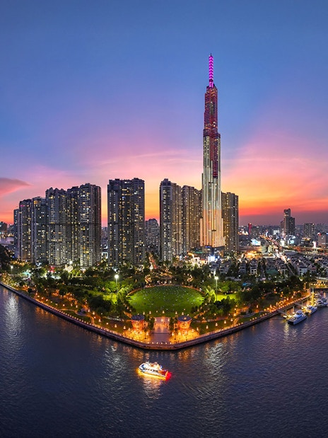 Ho Chi Minh City skyline at sunset with Landmark 81 and Saigon River, Vietnam.