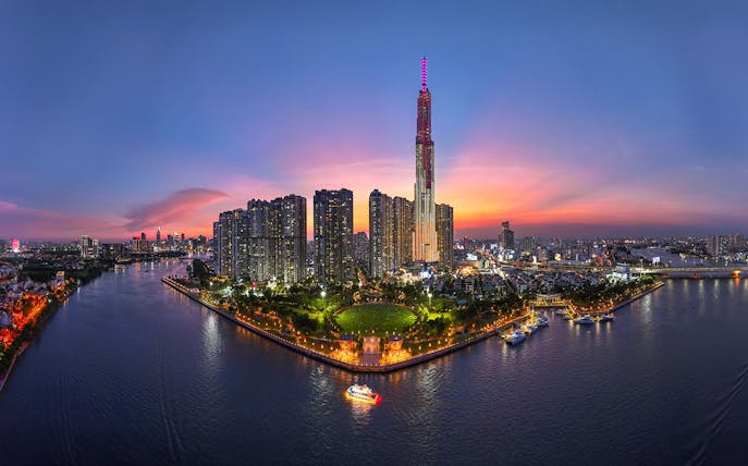 Ho Chi Minh City skyline at sunset with Landmark 81 and Saigon River, Vietnam.