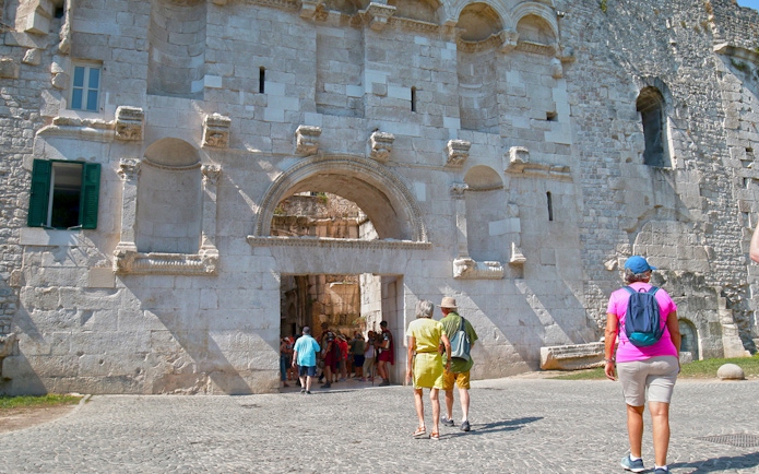 Visitors entering Diocletian's Palace through the Golden Gate in Split's Old Town.