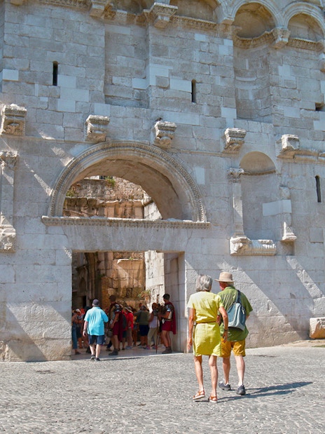 Visitors entering Diocletian's Palace through the Golden Gate in Split's Old Town.