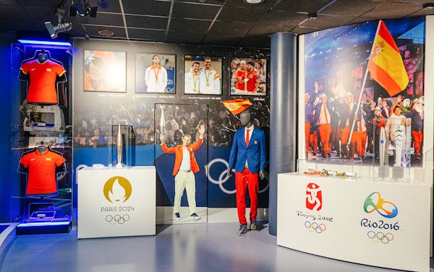 Interiors of the Rafa Nadal Museum Xperience showcasing Olympic memorabilia and Spanish sports attire.