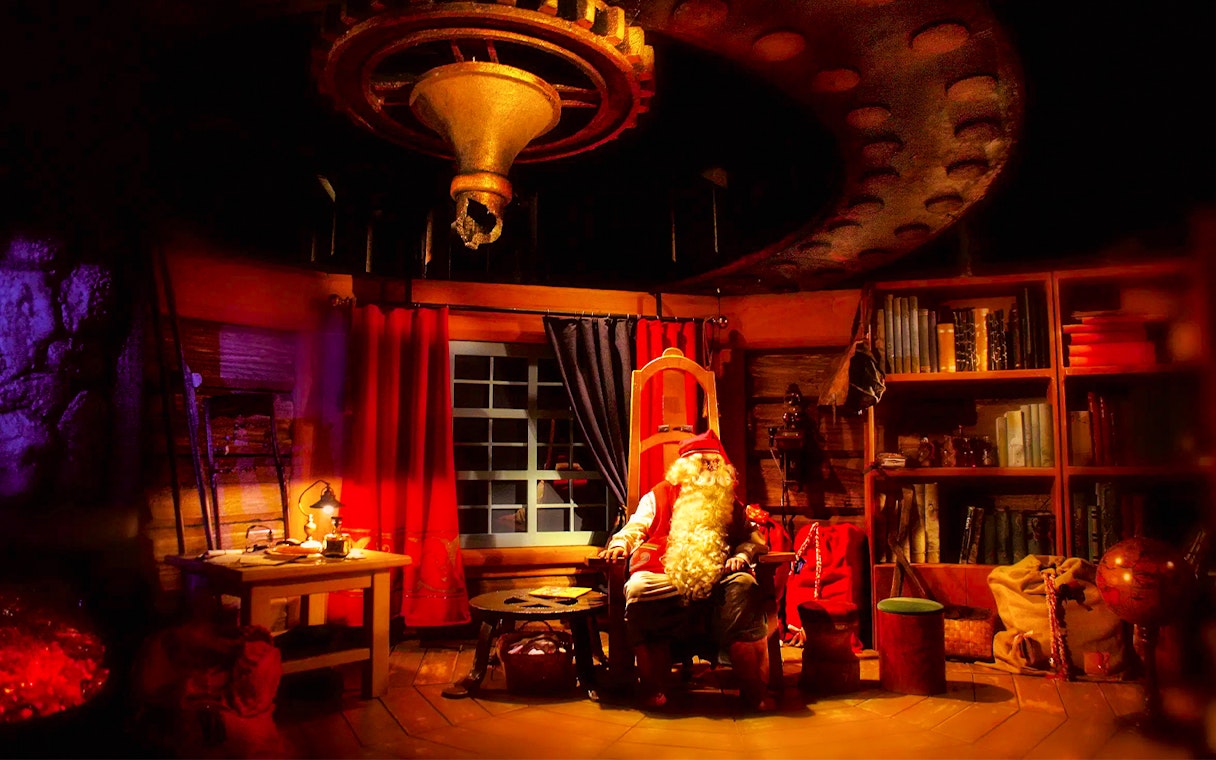 Santa Claus in his cozy office at Rovaniemi Santa Claus Village.