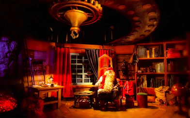 Santa Claus in his cozy office at Rovaniemi Santa Claus Village.