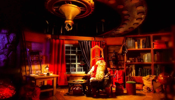 Santa Claus in his cozy office at Rovaniemi Santa Claus Village.