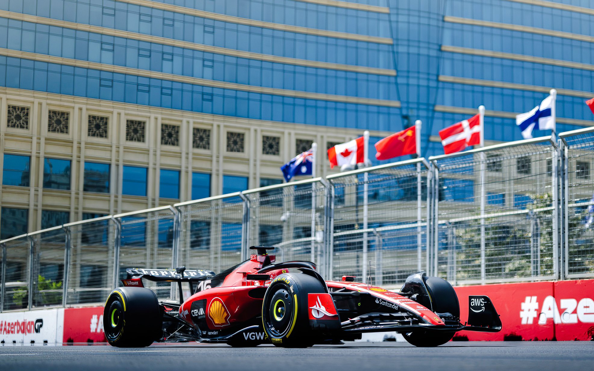 Red Formula 1 car racing on Baku city circuit during Azerbaijan Grand Prix 2026.