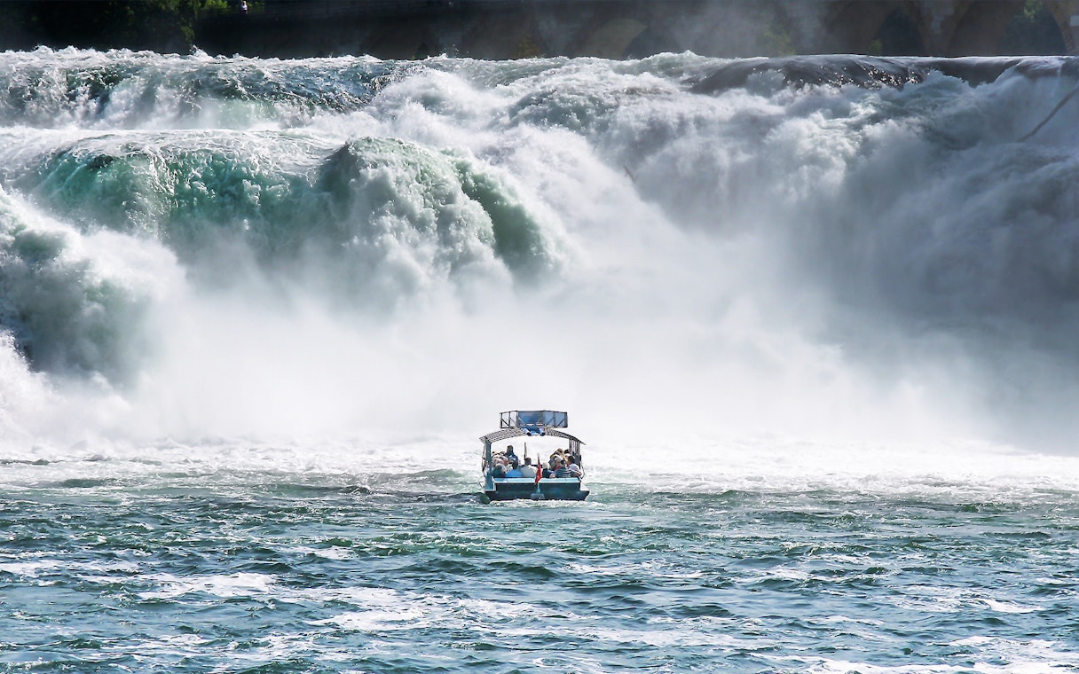 Boat approaching Rhine Falls in Switzerland.