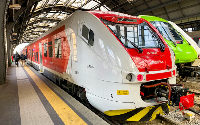 Malpensa Express train at a station platform in Milan, Italy.