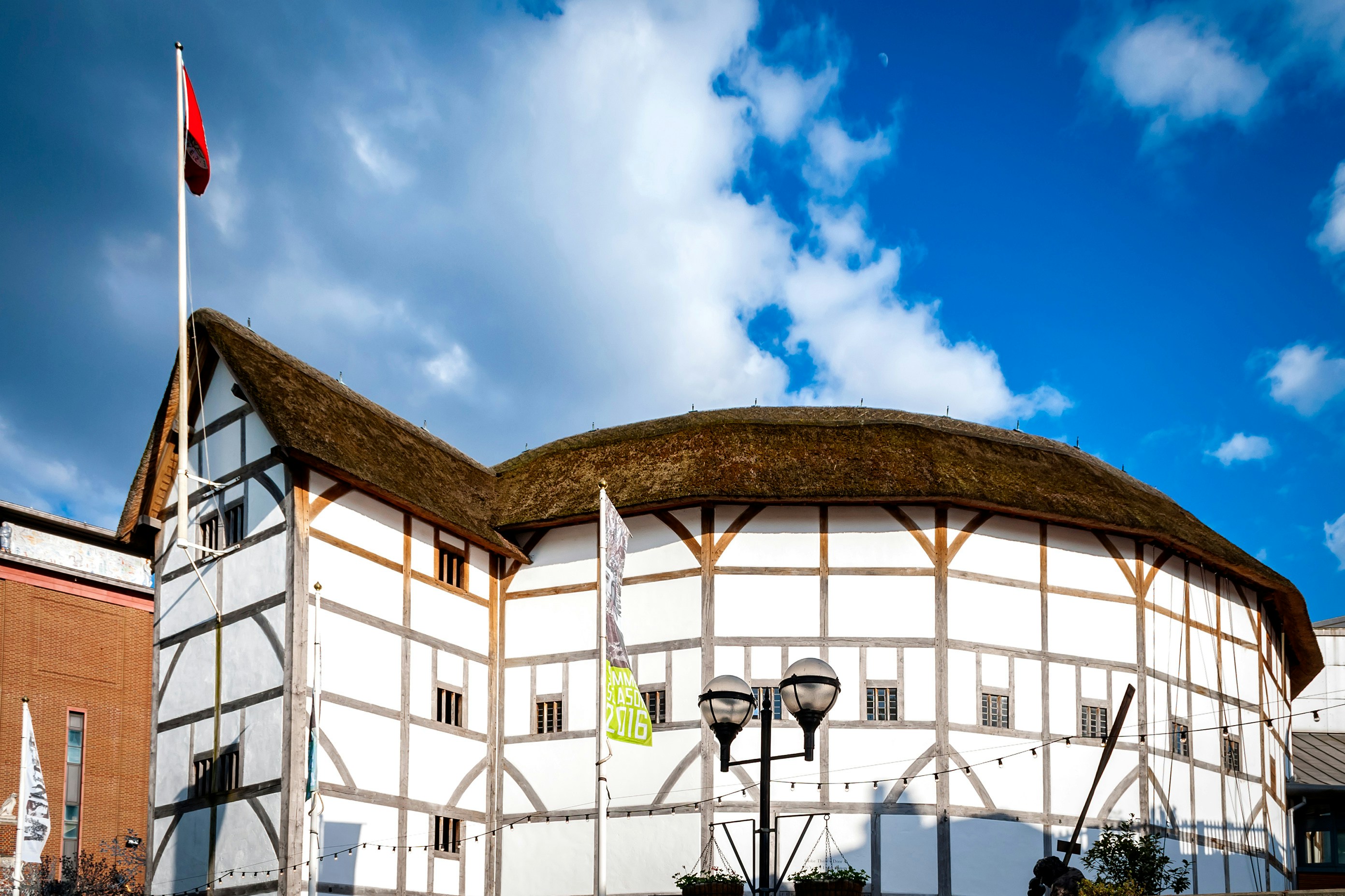 Shakespeare's Globe Theatre exterior with thatched roof in London.