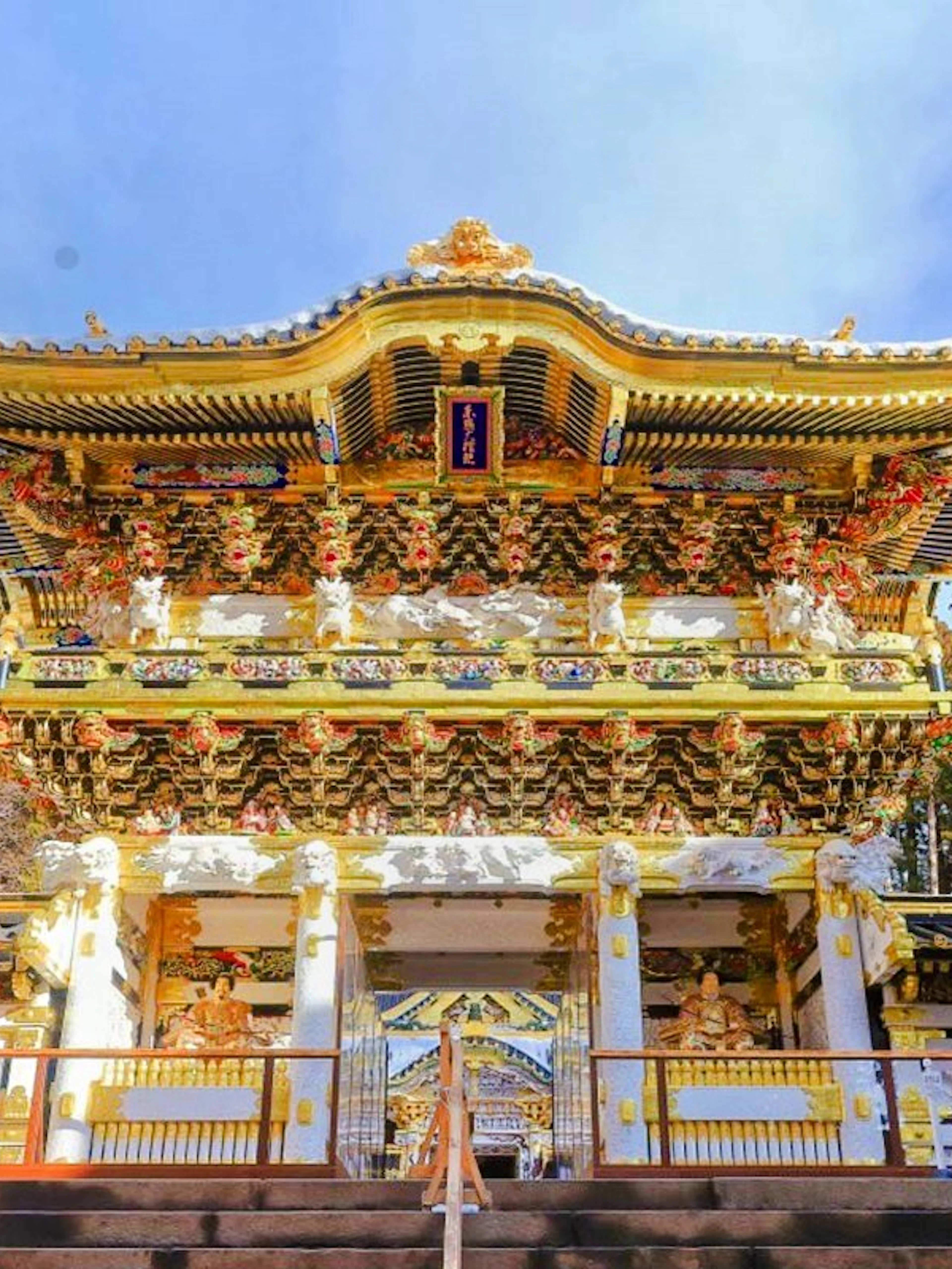 Nikko Toshogu Shrine ornate gate with intricate carvings and gold accents in Japan.
