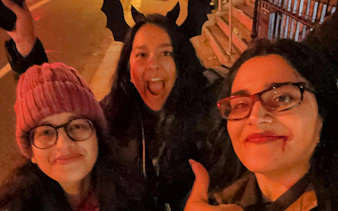 Participants enjoying Dublin Ghost Hunt with costumes and props at night.