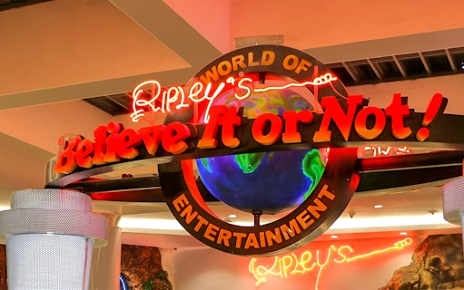 Ripley's Believe It Or Not! Museum entrance sign with neon lights and globe.