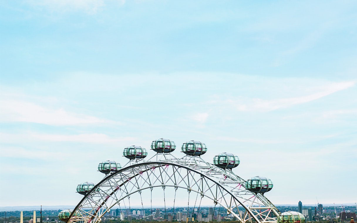 London Eye observation wheel with city skyline in the background.