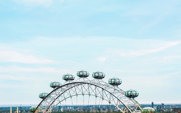 London Eye observation wheel with city skyline in the background.