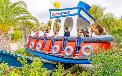 Visitors enjoying a boat-themed ride at Zoomarine Portugal.