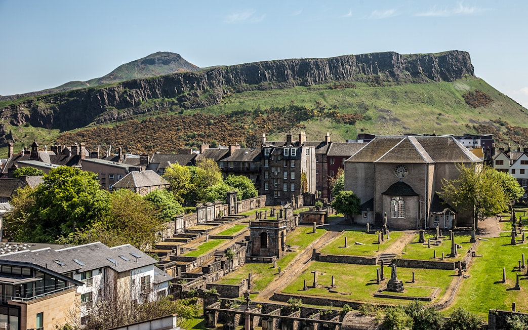 Canongate Kirk and cemetery with Arthur's Seat in the background, Edinburgh.