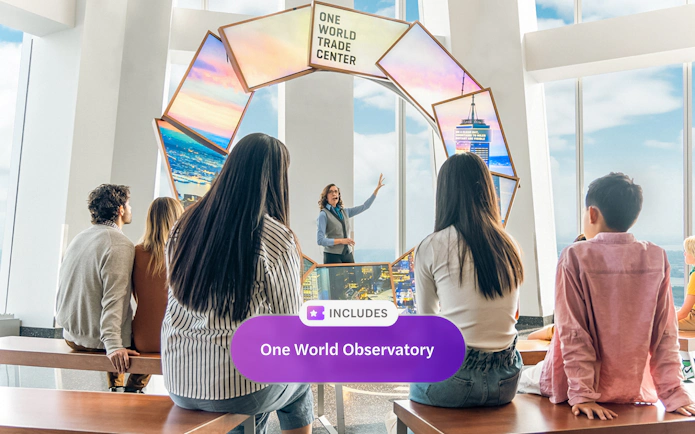 Tourists engaging with City Pulse display at One World Observatory, New York City.