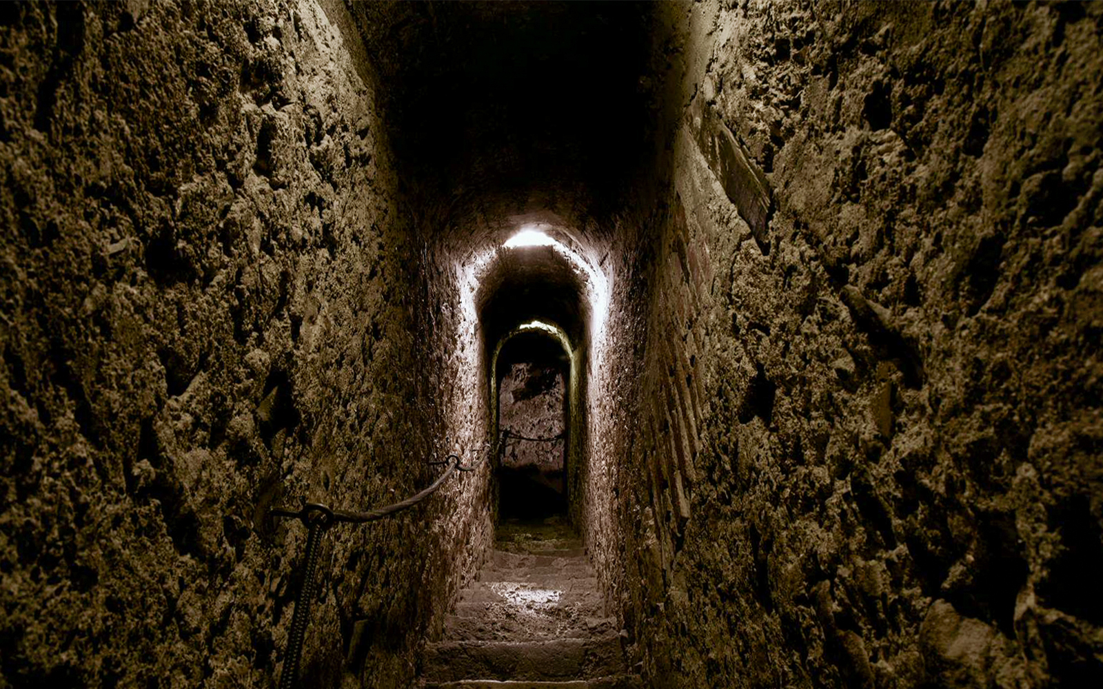 Narrow stone corridor inside Bran Castle, Romania.