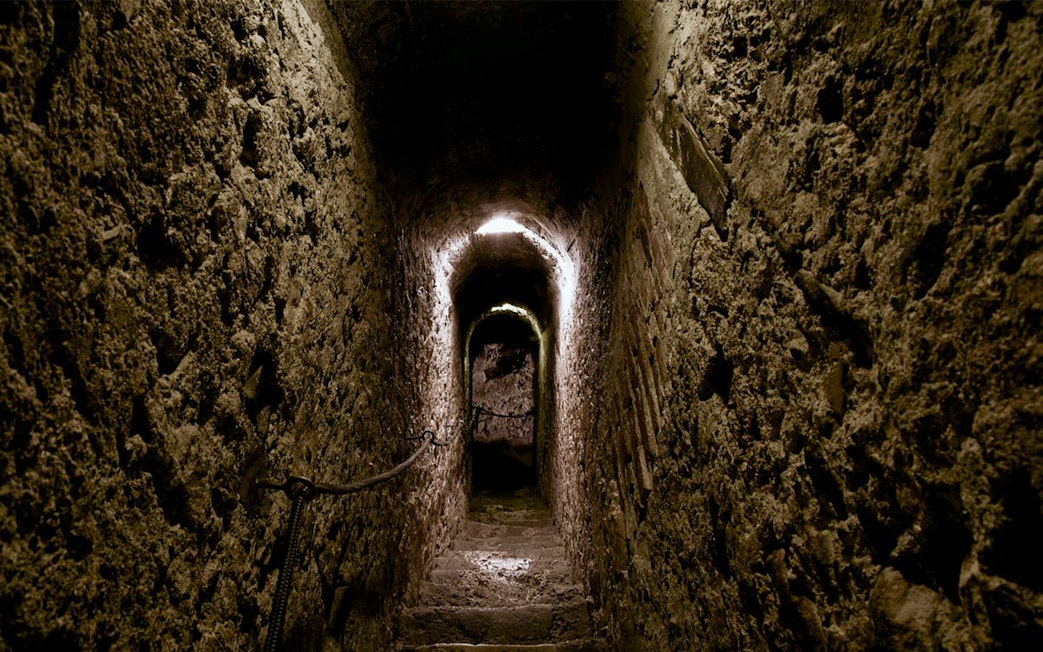 Narrow stone corridor inside Bran Castle, Romania.
