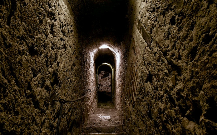 Narrow stone corridor inside Bran Castle, Romania.