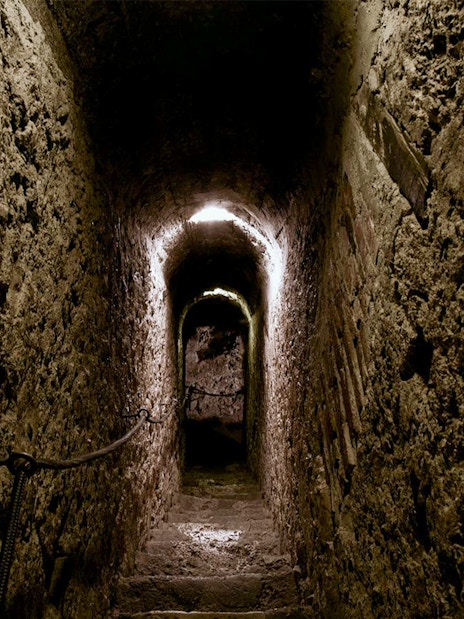 Narrow stone corridor inside Bran Castle, Romania.