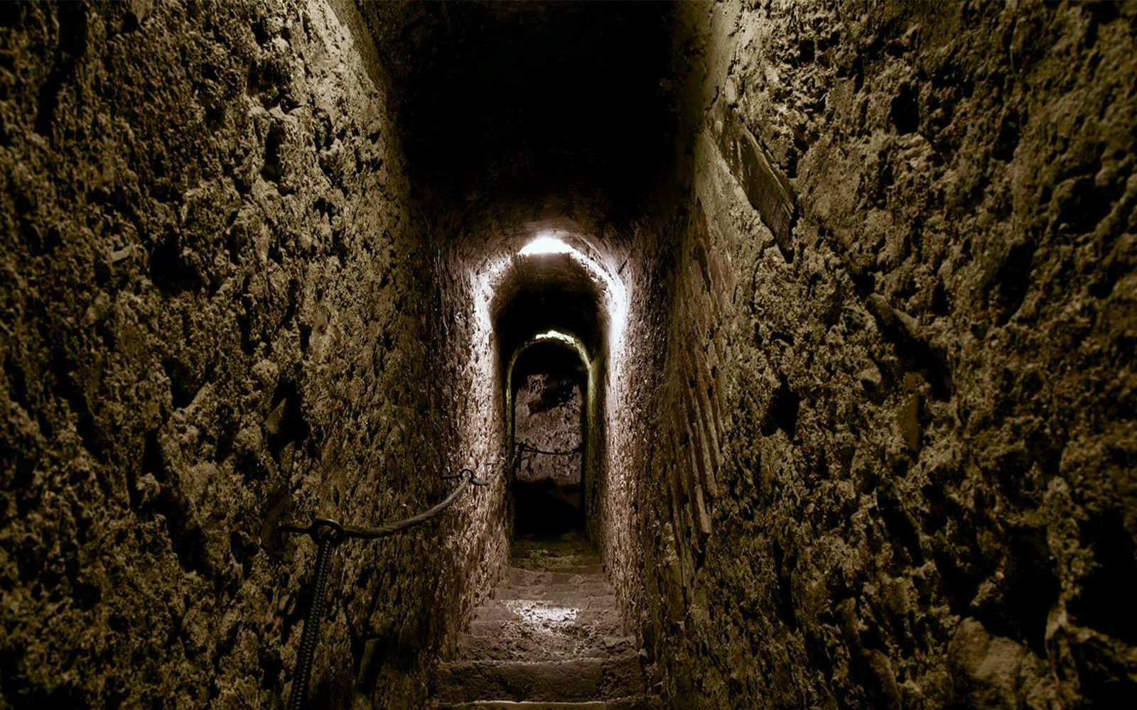 Narrow stone corridor inside Bran Castle, Romania.