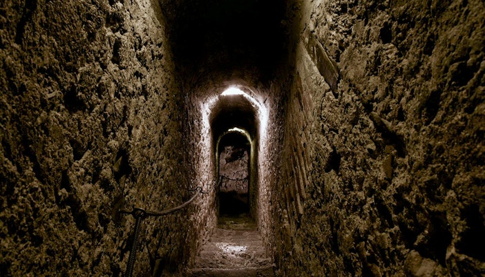 Narrow stone corridor inside Bran Castle, Romania.