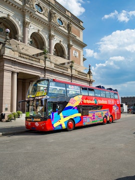 Open-top tour bus in front of the Royal Swedish Opera, Stockholm.