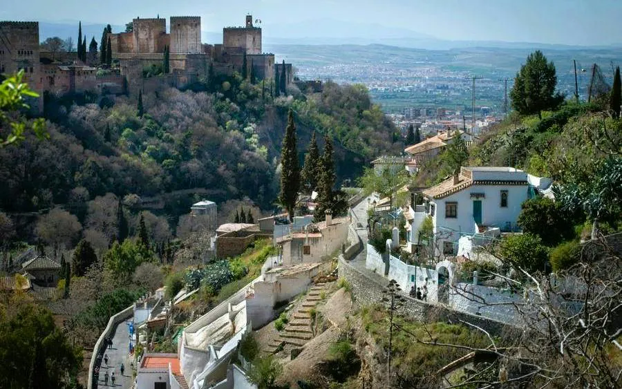Sacromonte hillside view with Alhambra in the background, Granada.
