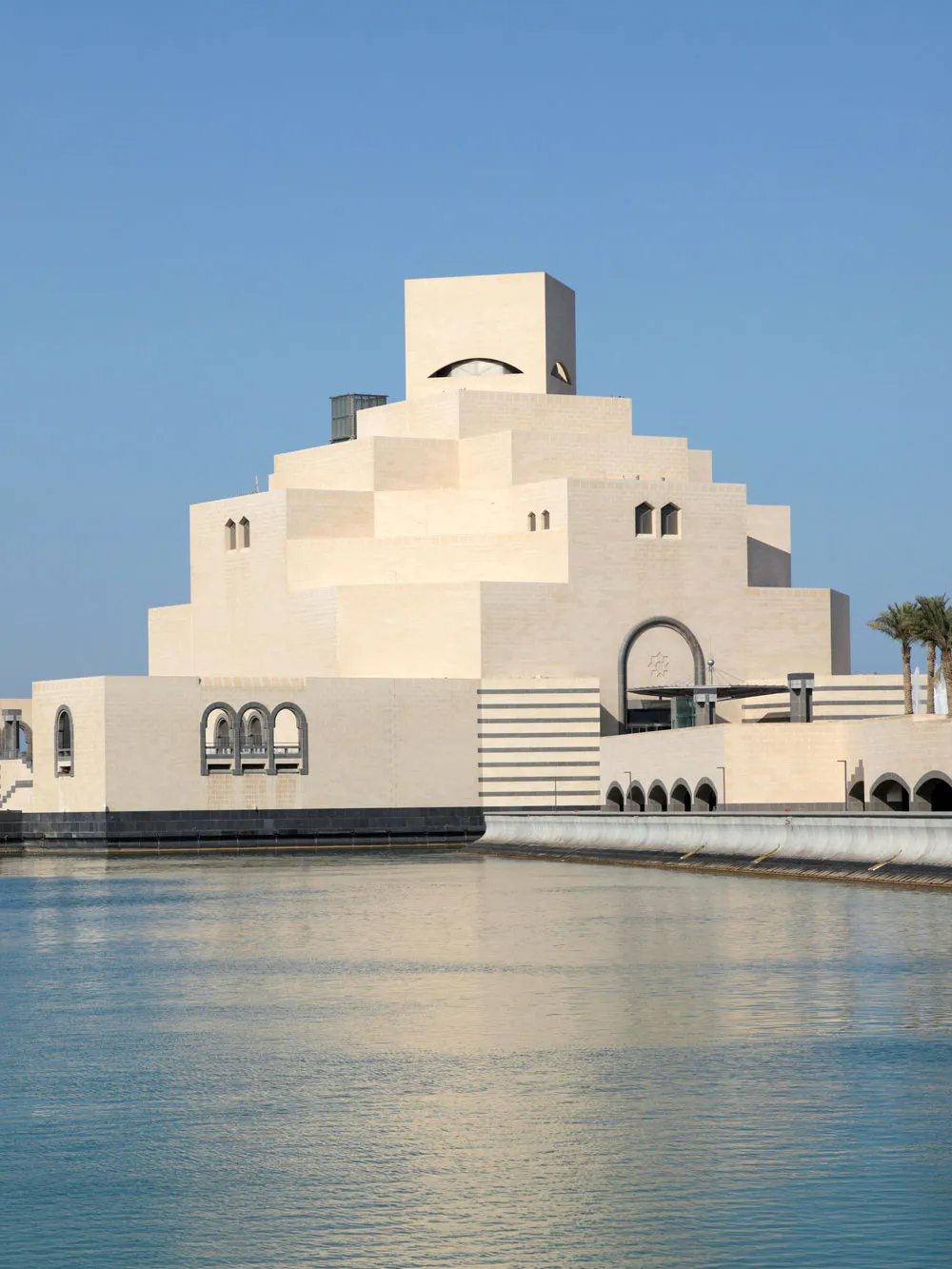 Museum of Islamic Art in Doha, Qatar, with geometric architecture by the waterfront.