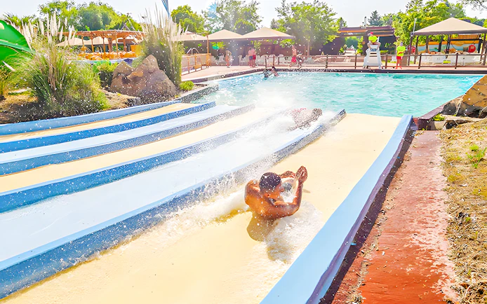 People sliding down the Pistas Blandas water slide at Aquopolis.