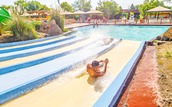 People sliding down the Pistas Blandas water slide at Aquopolis.