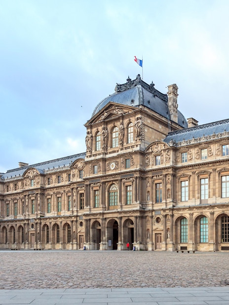 Louvre Museum courtyard in Paris, France, part of a skip-the-line tour with audioguide.