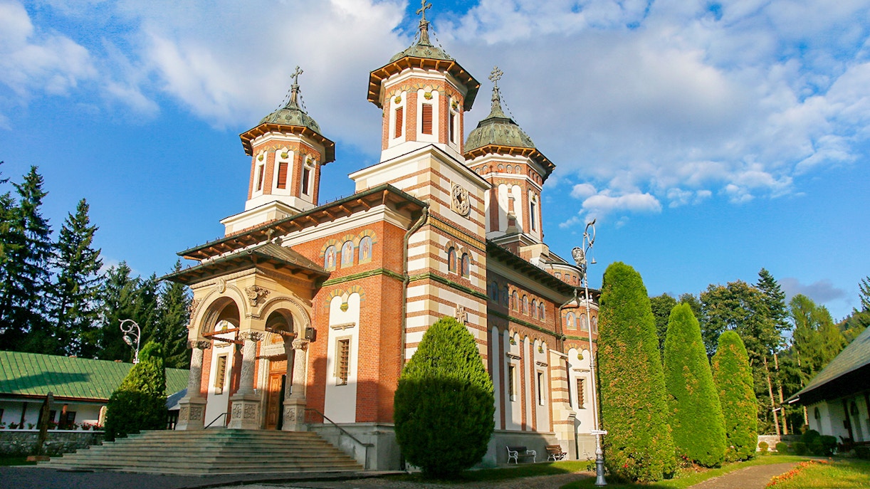 Monastery of Sinaia with Carpathian Mountains backdrop in Sinaia, Romania.