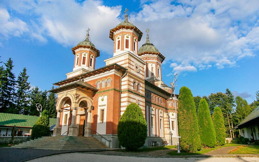 Monastery of Sinaia with Carpathian Mountains backdrop in Sinaia, Romania.
