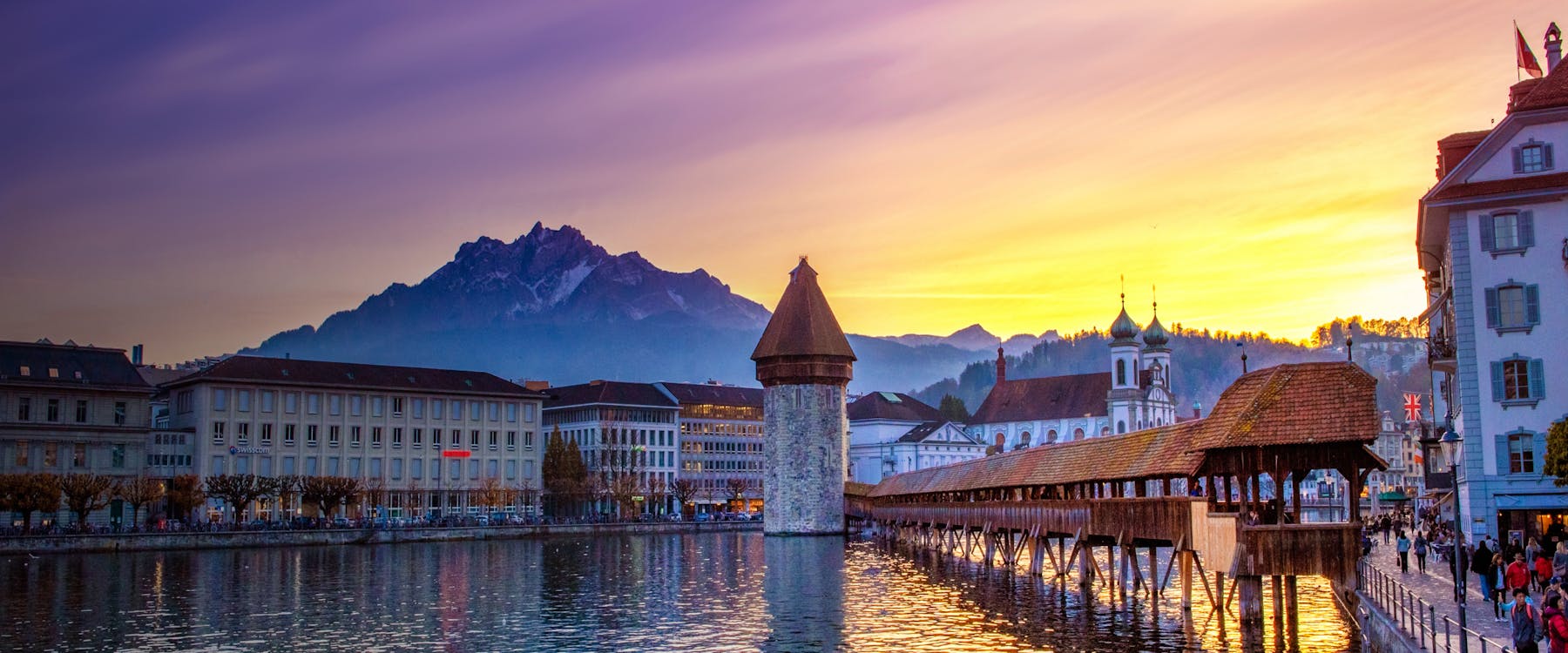Chapel Bridge and Water Tower at sunset in Lucerne, Switzerland.