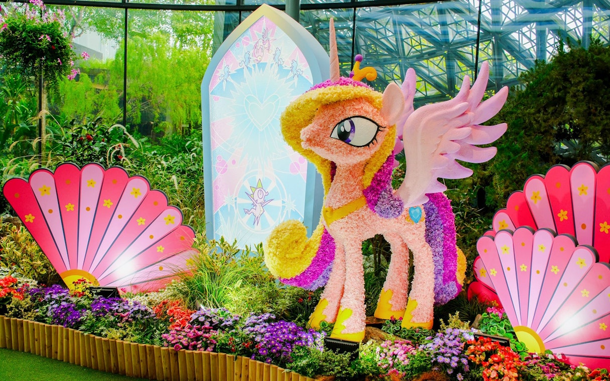 My Little Pony floral sculpture at Gardens by the Bay, Singapore, surrounded by vibrant flowers.