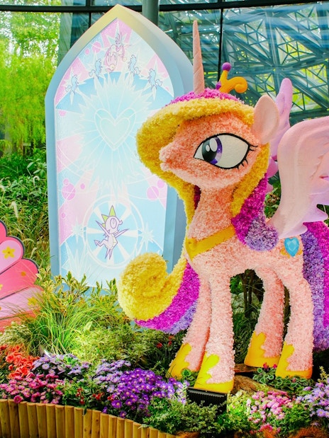 My Little Pony floral sculpture at Gardens by the Bay, Singapore, surrounded by vibrant flowers.